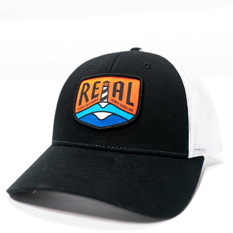 REAL Lighthouse Badge Trucker Hat-Black/White